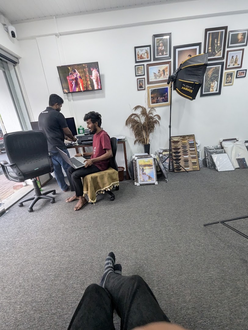 Staff working with a customer at the studio desk