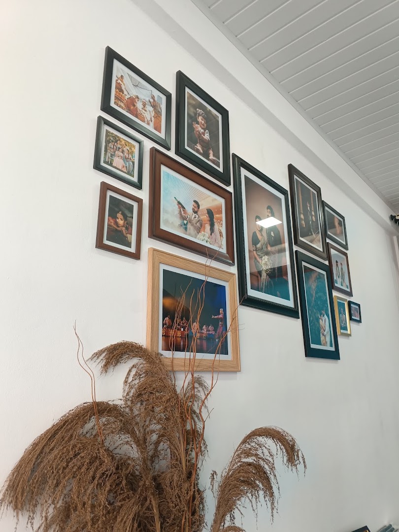 Framed portraits displayed along the studio wall